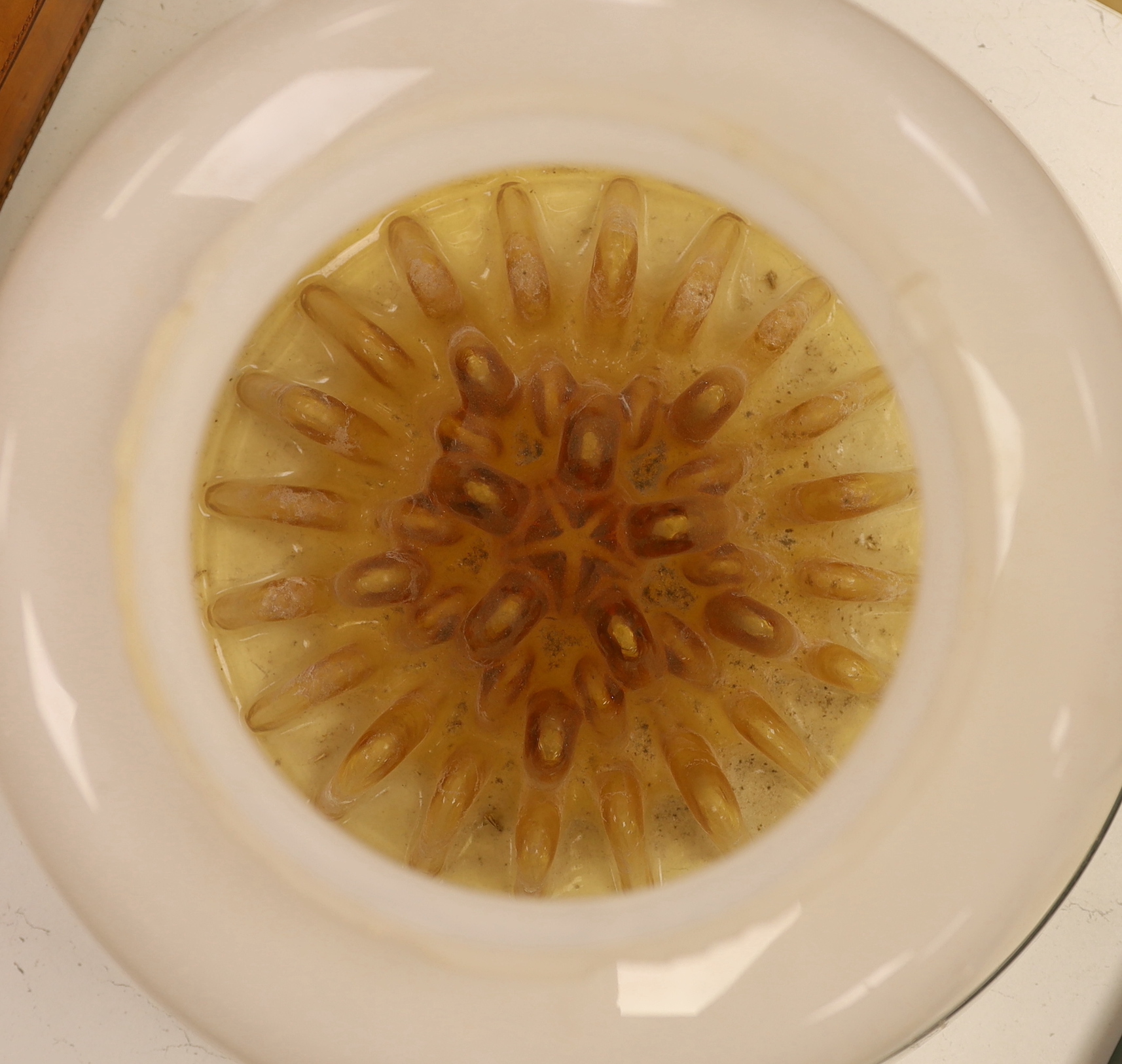 A large 1970's amber and opaque glass ceiling shade, 32cm high